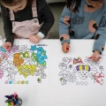 2-girls---classic-and-mini-on-white-table.webp